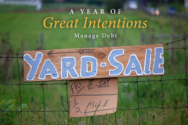 A Year of Great Intentions: Manage Debt | Photo of yard sale sign on a fence