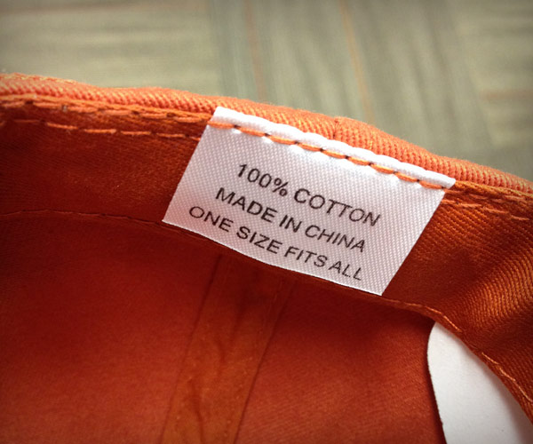 Image of tag inside baseball cap that reads "Made in China"