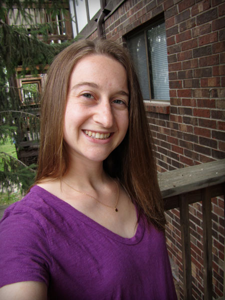 Julia in a purple thrift store t-shirt