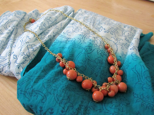 Teal-to-white ombre scarf and coral beaded necklace