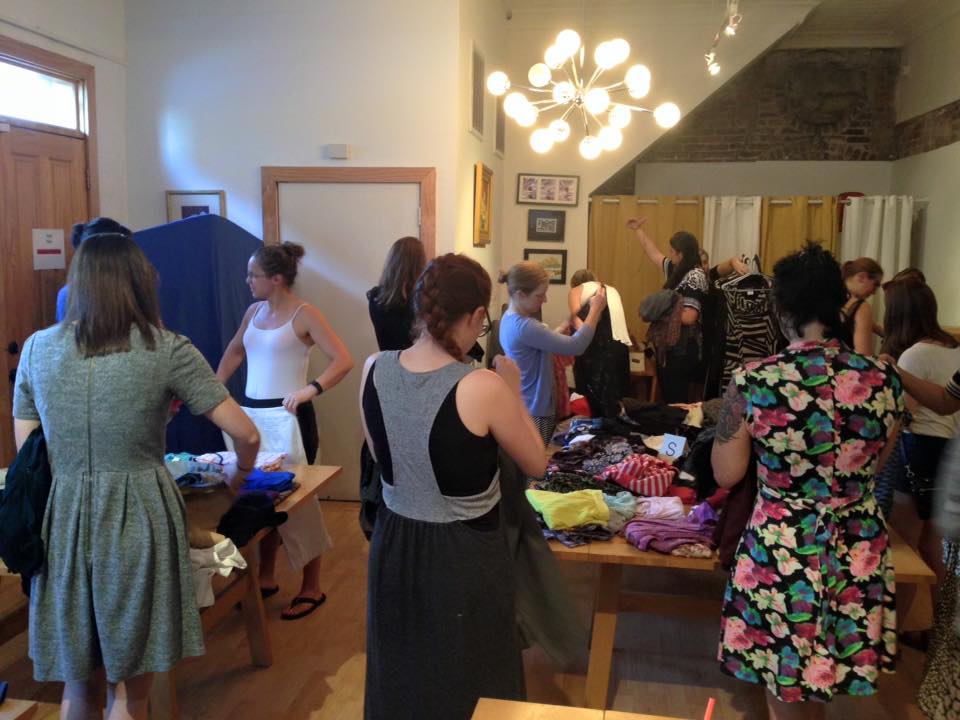 Women browsing clothing at New Day Craft