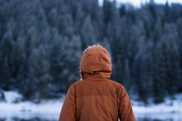 Back of person in winter coat made of performance fabric