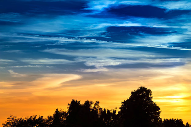 Sky turning from blue to gold during sunset