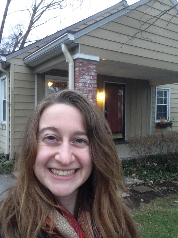 Julia in front of her house